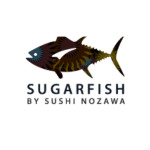 A stylized fish logo appears above the text. The words read: "SUGARFISH by SUSHI NOZAWA." The fish illustration features vibrant colors and intricate patterns.